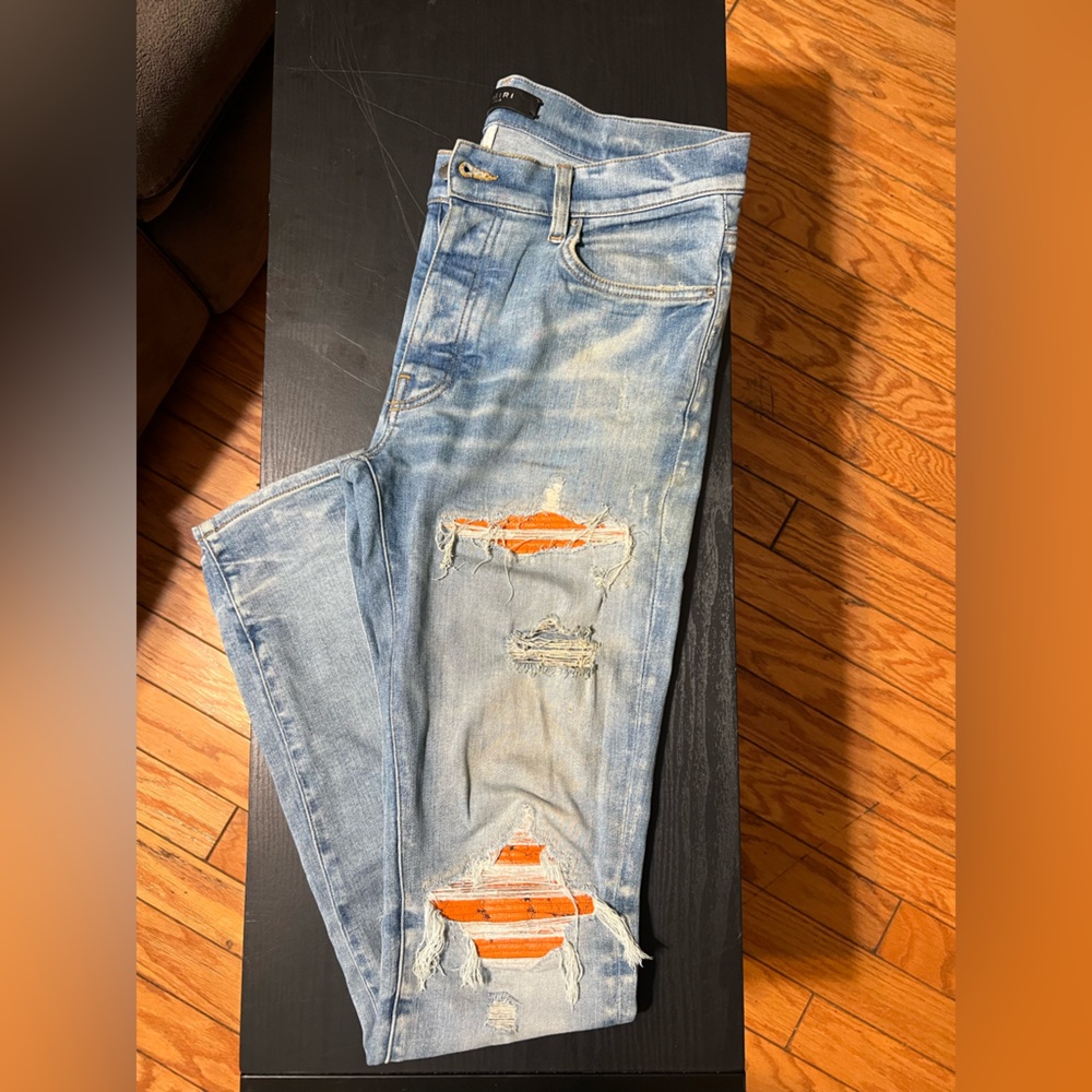 SOLD Authentic AMIRI Light Blue Distressed Jeans with Orange Accents